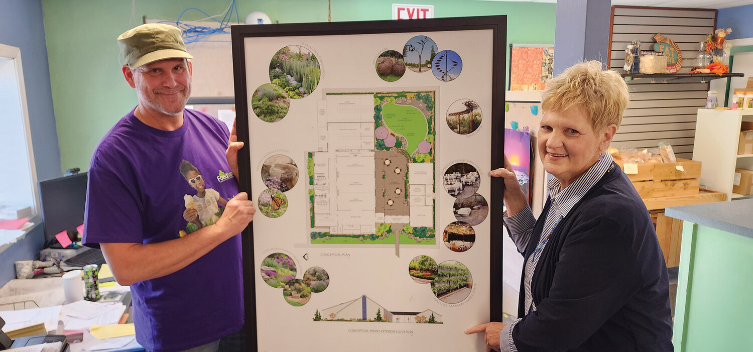 Executive Director Elizabeth Cerveny and Program Coordinator Darin McClure display their future dream for a new North County Community Food Bank building.